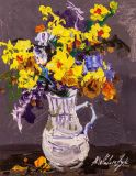 A multicolored bouquet in a jug