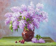 Bouquet of lilacs in a clay jug on the table