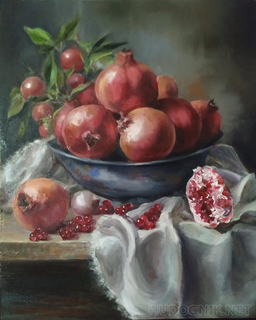 Early pomegranates in an iron bowl