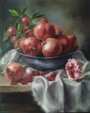 Early pomegranates in an iron bowl