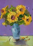 A bouquet of sunflowers in a blue vase
