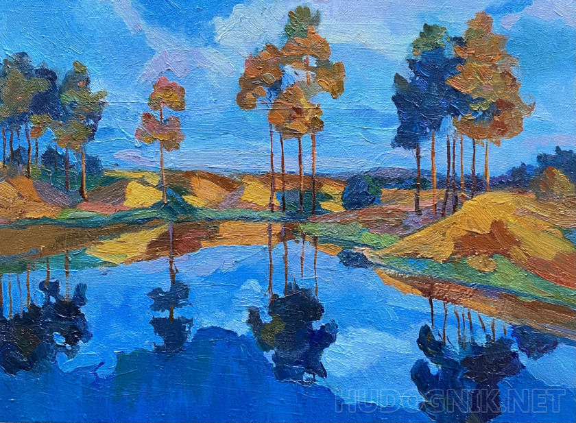 Landscape with a lake and tall trees