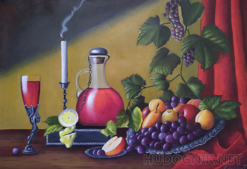 Still life with red wine and candles and grapes.