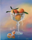 Mandarinas en un jarrón de cristal