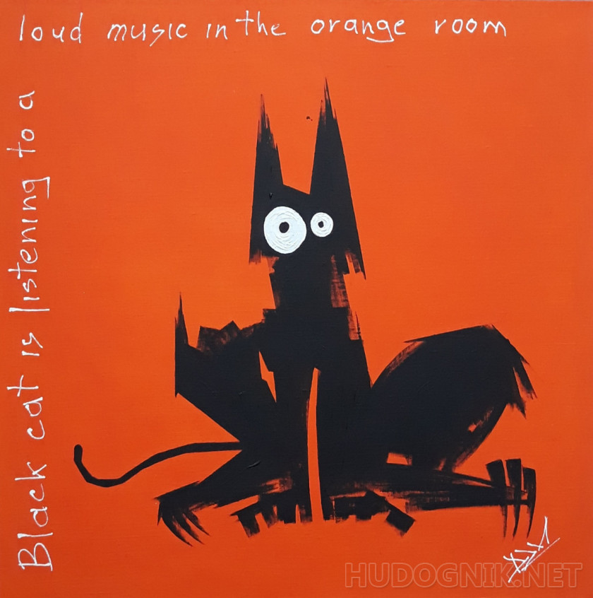 Чёрный кот слушает громкую музыку в оранжевой комнате.