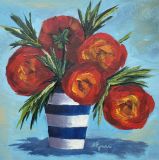 Red flowers in a striped vase