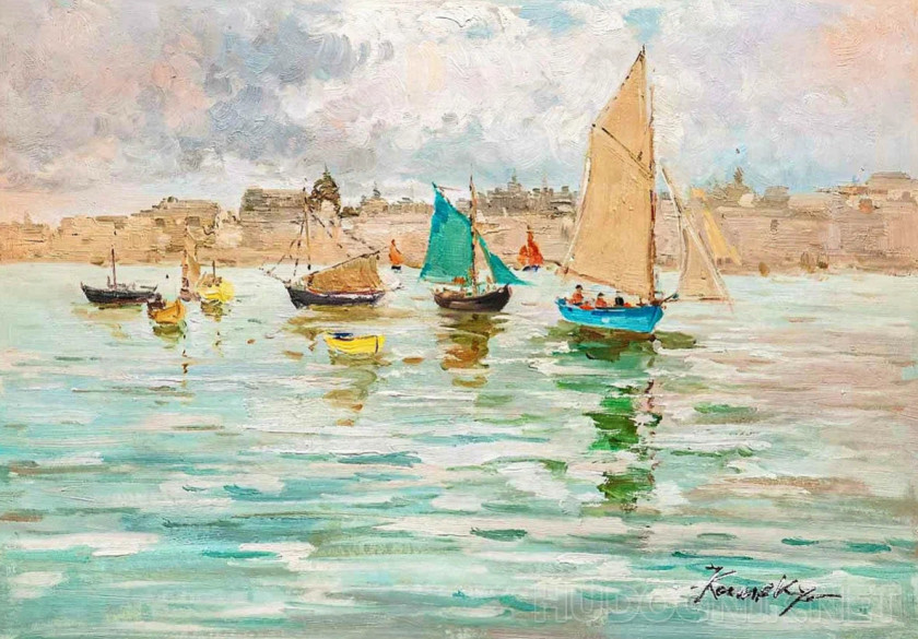 Boats in the azure sea on the background of the city