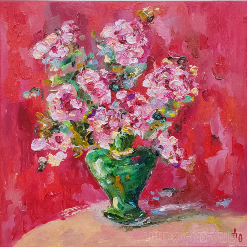 Bouquet on a red background in a malachite-colored vase